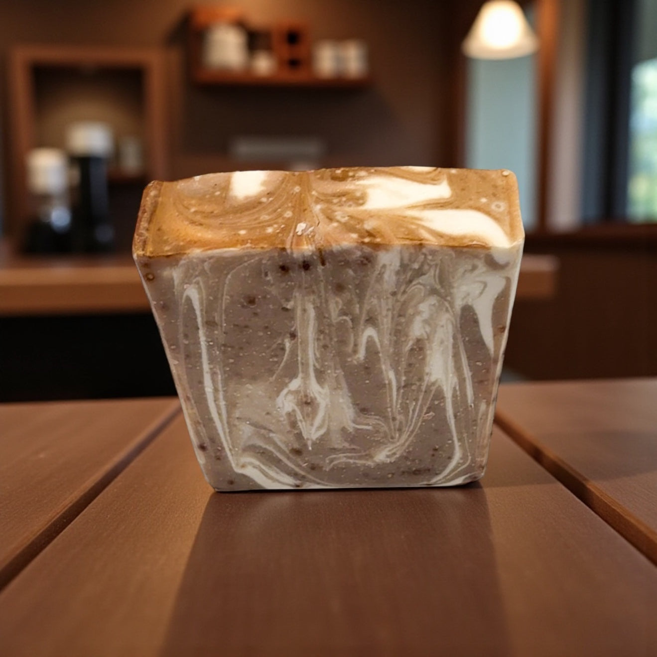 Marble-patterned container on a wooden surface with a blurred indoor background