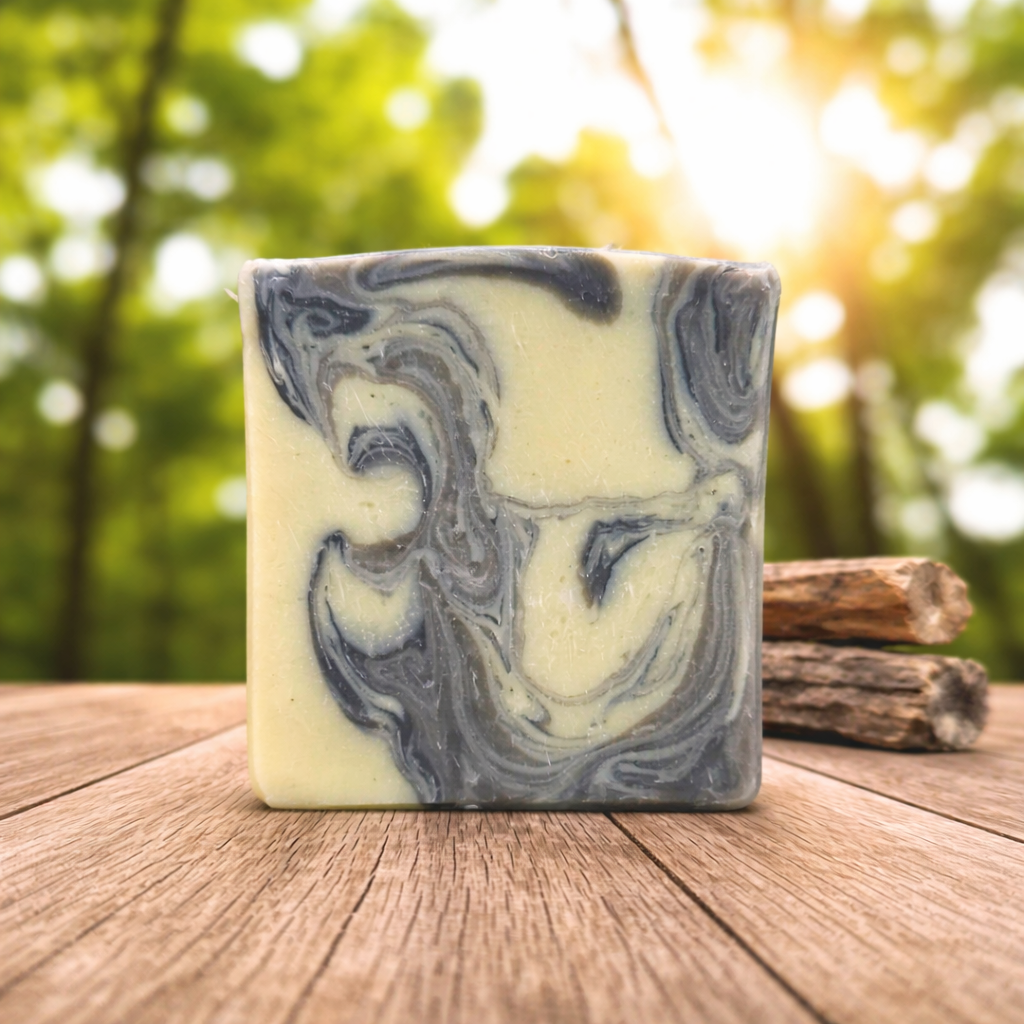 Marbled soap bar on a wooden surface with a natural background