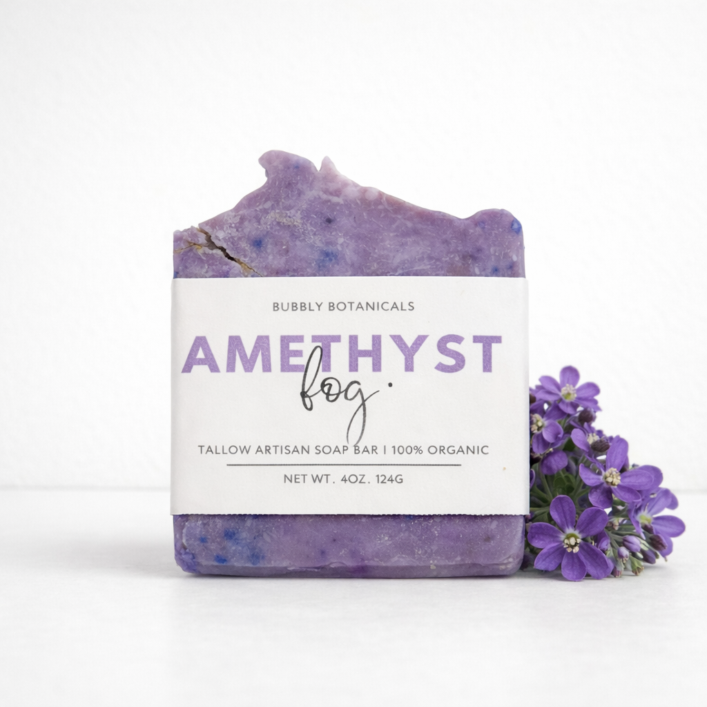 Tallow soap bar with 'Amethyst Fog' label and purple flowers on a white background