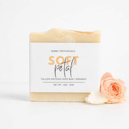 Bar of Soft Petal tallow soap with a label and a rose on a white background