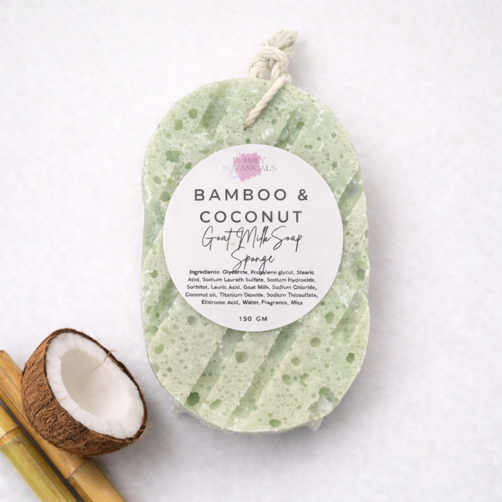 Green bamboo and coconut goat milk infused soap sponge with a label on a white background
