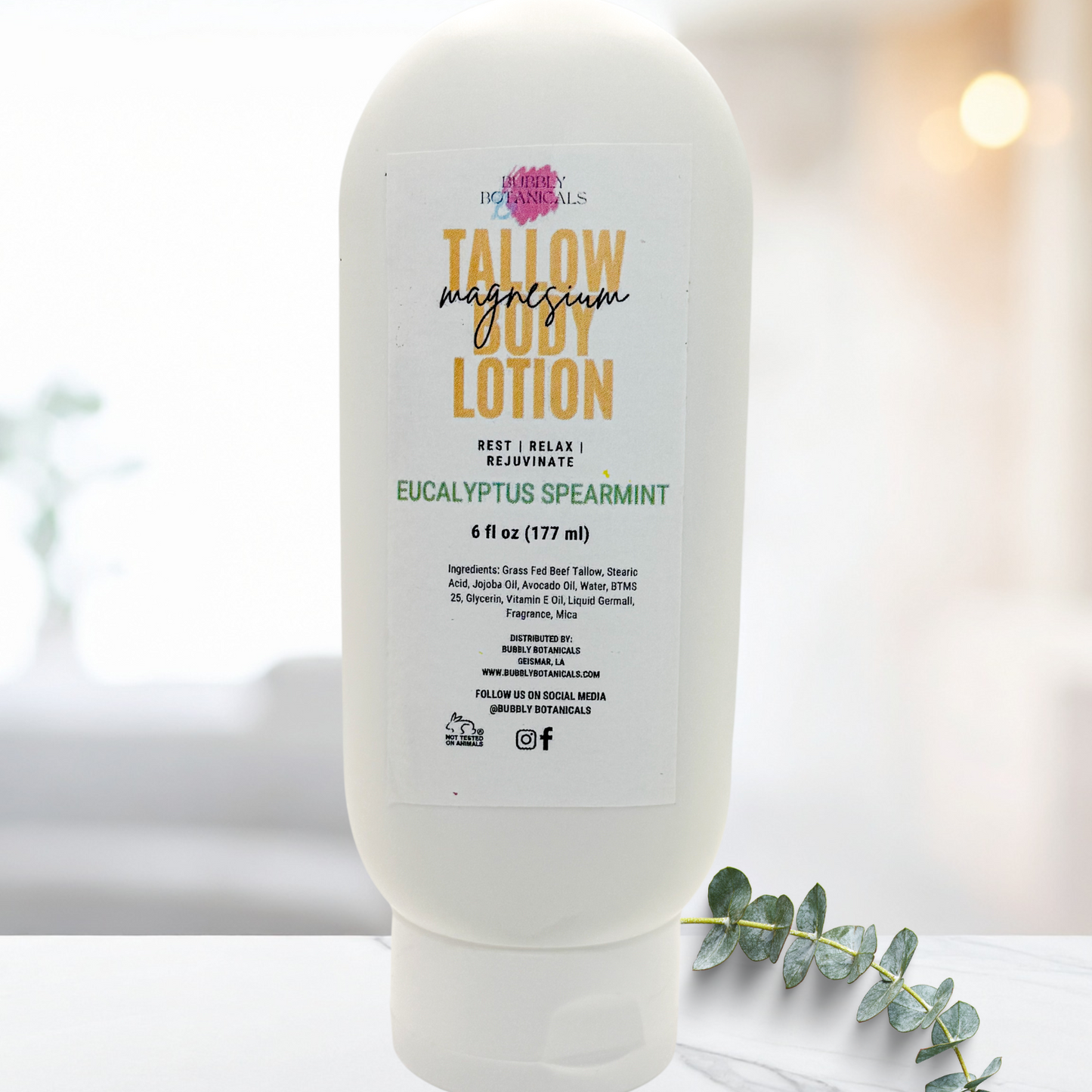 Tallow Magnesium Lotion bottle on a white surface with a blurred background