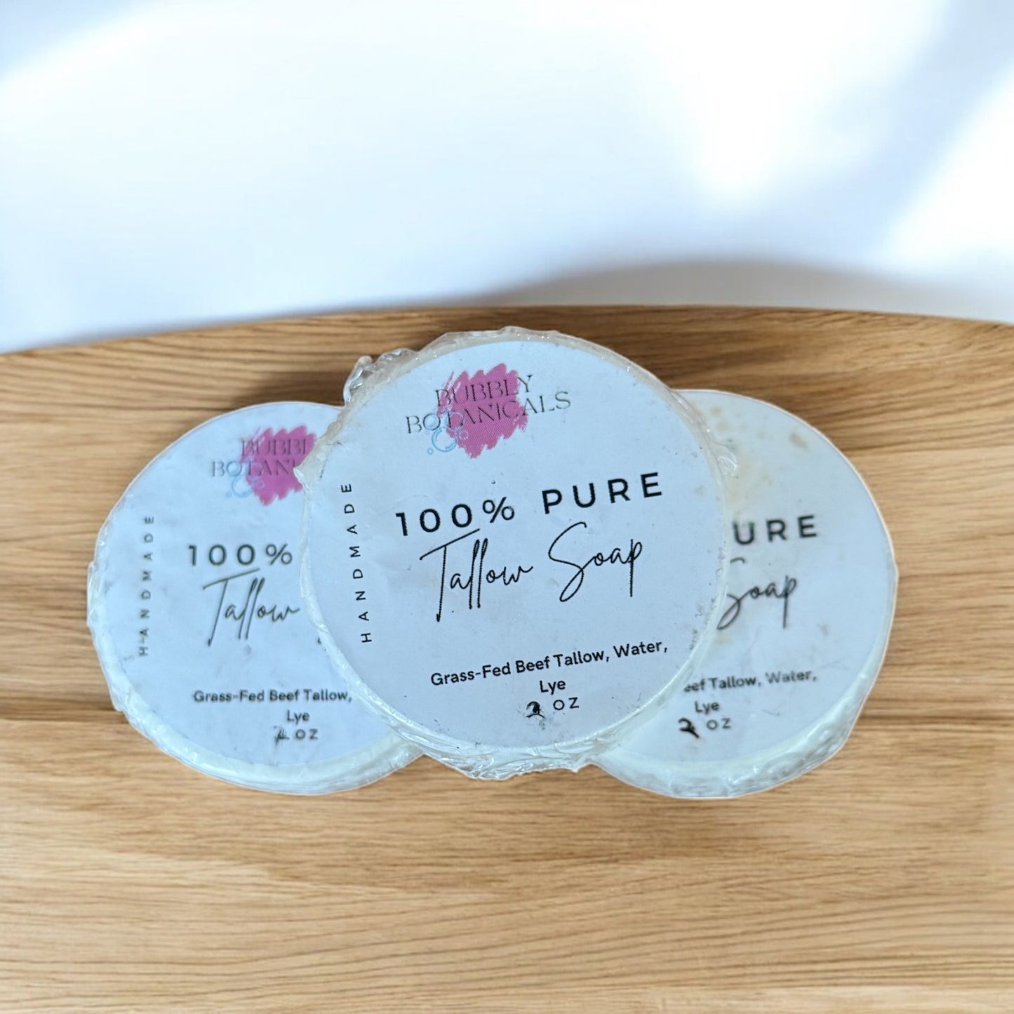 100% pure tallow mini soaps on a wooden counter