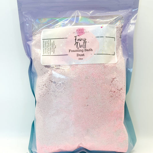 Packaged fairy dust foaming bath dust with a label on a white background