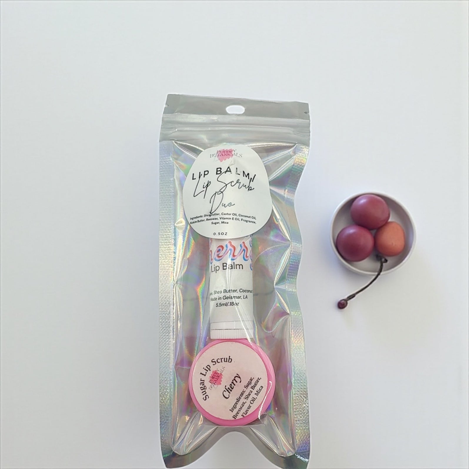 Packaged lip balm with cherry flavor on a white background