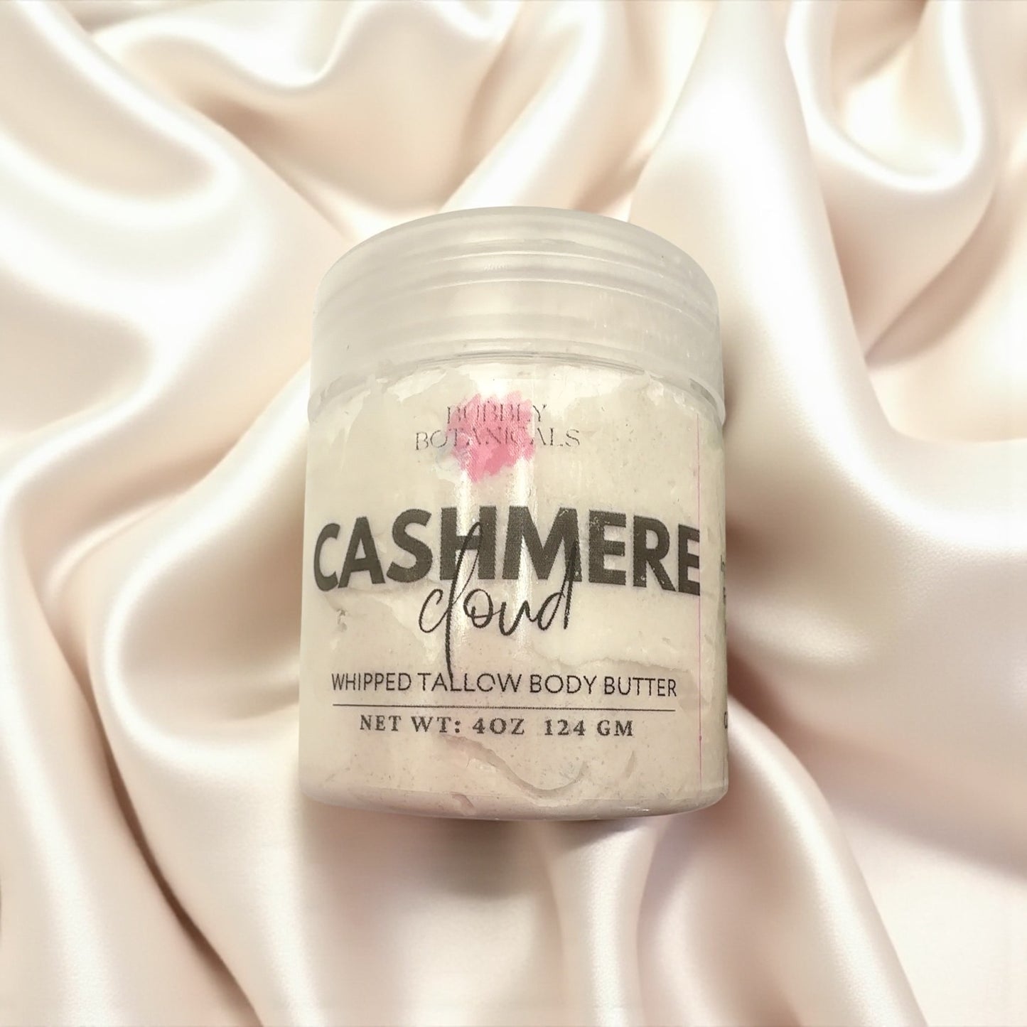 Jar of Bobby Botanicals Cashmere Cloud Whipped Tallow Body Butter on a satin background