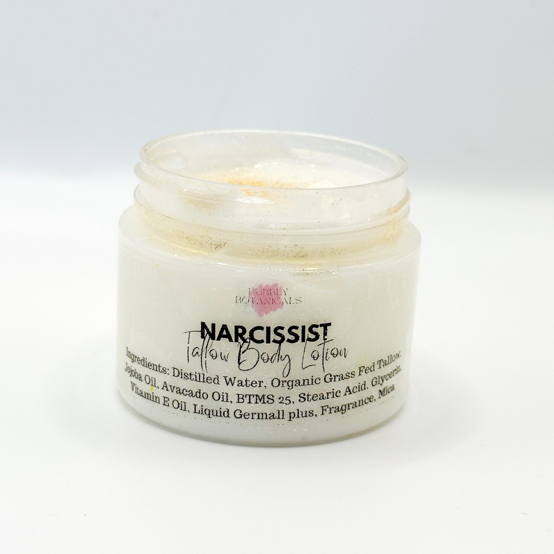 Jar of 'Narcissist' body lotion with visible text on a white background