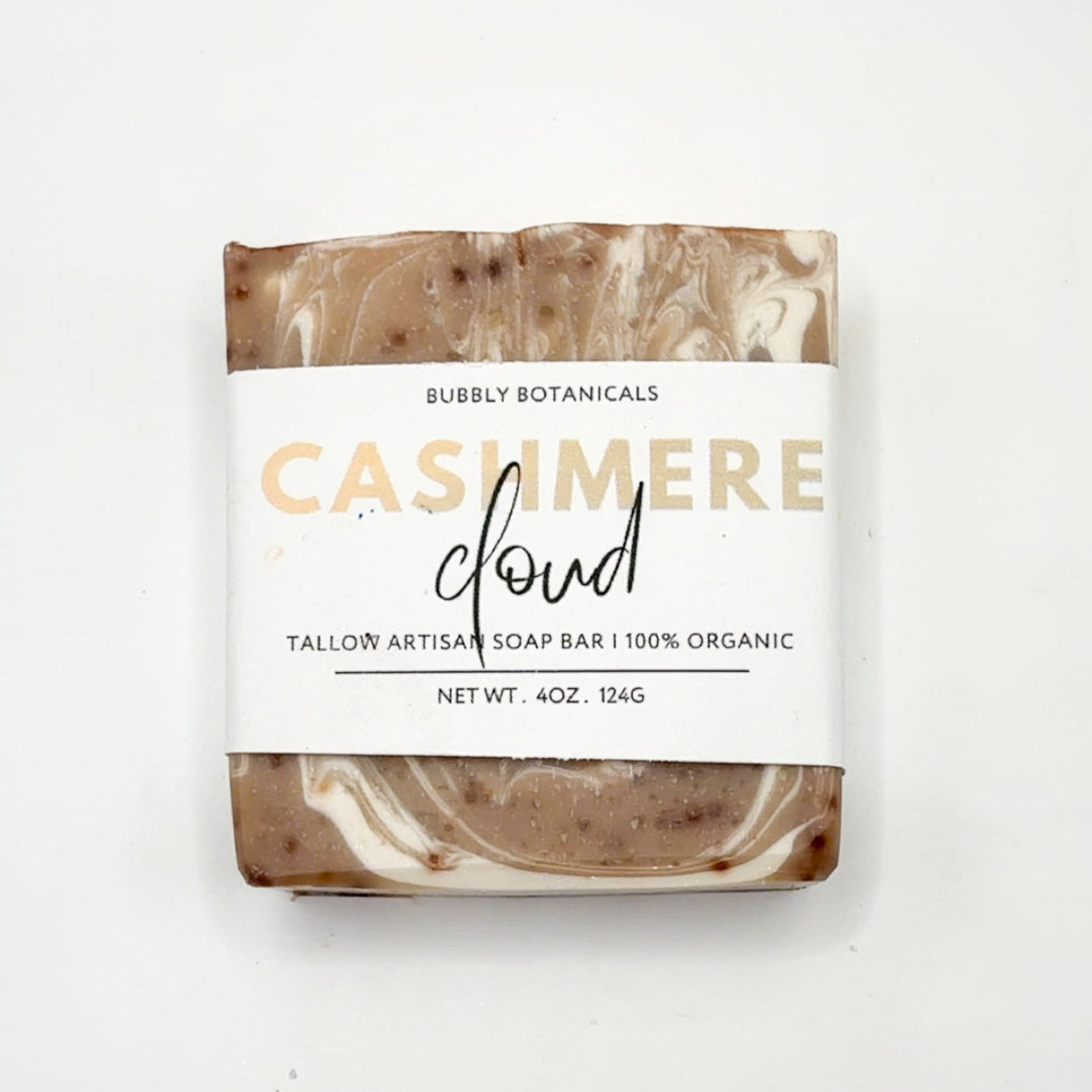 Bar of soap with a marbled design and 'Bubbly Botanicals' label on a white background