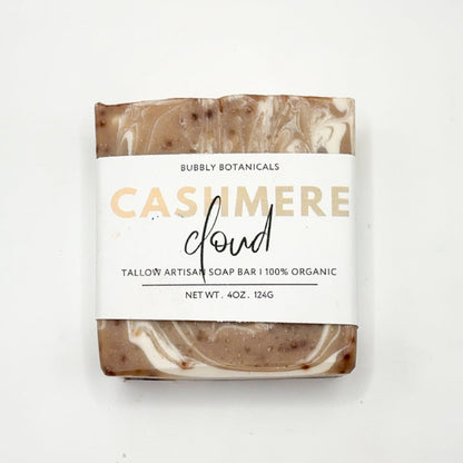Bar of soap with a marbled design and 'Bubbly Botanicals' label on a white background