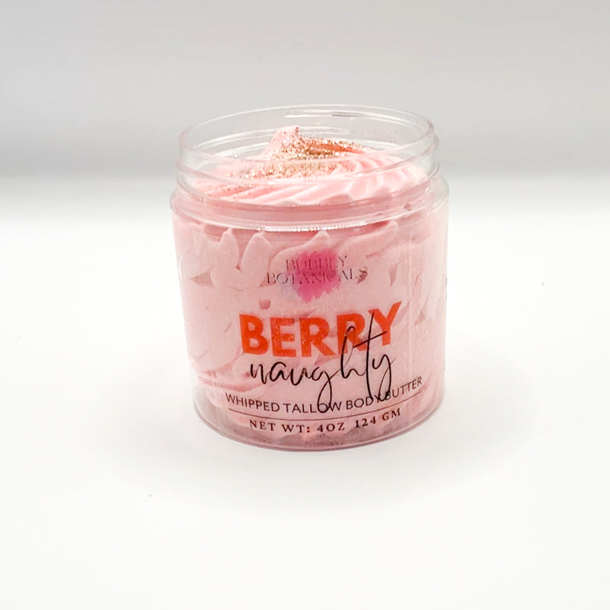 Jar of pink whipped tallow body butter labeled 'Berry Naughty' on a white background