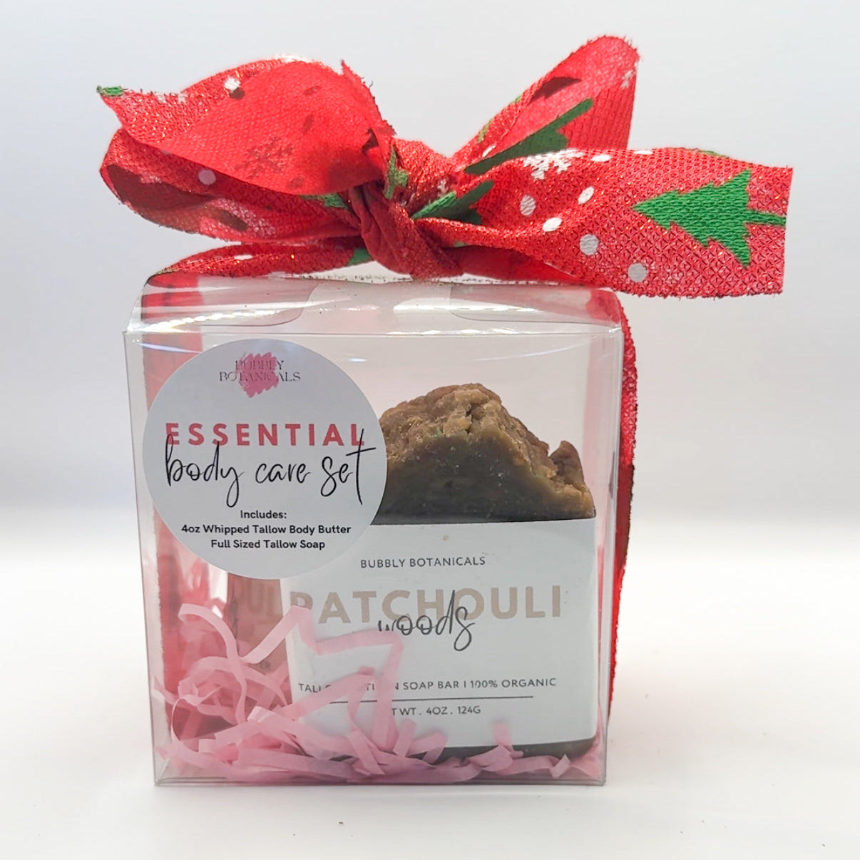 Essential body care set with a red bow on a white background