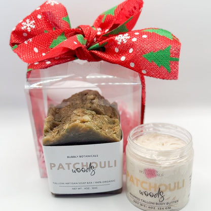 Patchouli-scented soap and candle set with a decorative red bow on a white background