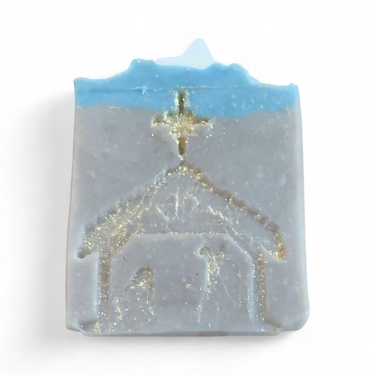 Soap bar with a nativity scene design on a white background