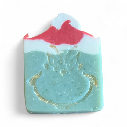 Soap bar with a design of a volcano and ocean waves on a white background
