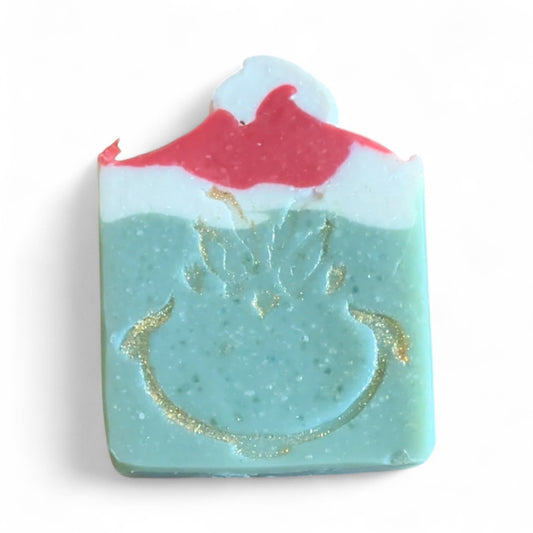 Soap bar with a design of a volcano and ocean waves on a white background