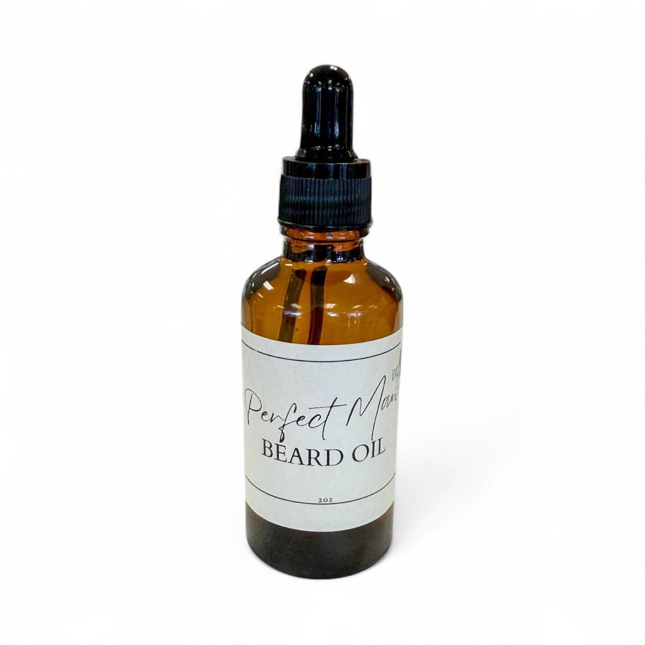 Brown glass bottle with black dropper labeled 'Perfect Man Beard Oil' on a white background