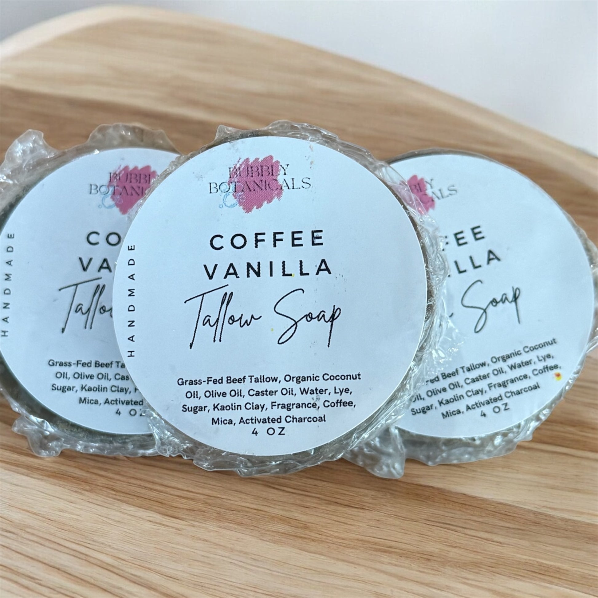 Coffee vanilla mini tallow soaps on a wood counter 