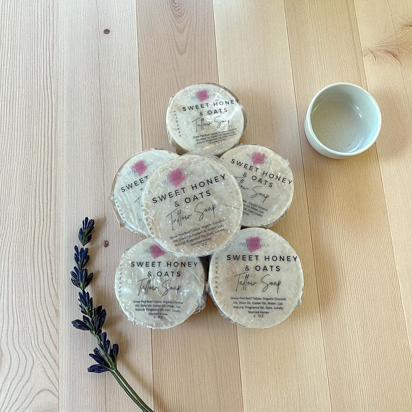 Sweet honey and oats mini tallow soaps on a wooden table 