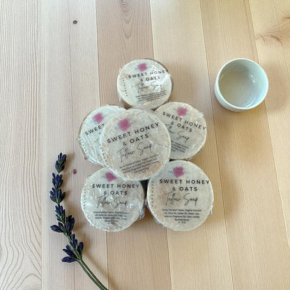 Sweet honey and oats mini tallow soaps on a wooden table 