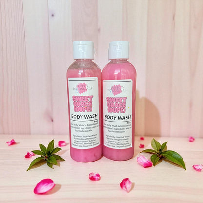 Sweet Grace dupe body wash on a table with floral petals all around