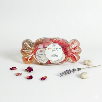 Decorative candy dish with a sweet treat, surrounded by dried flowers and lavender on a light background.