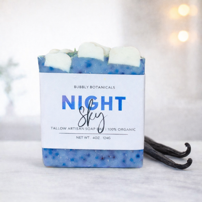 Handmade Night Sky vanilla tallow soap bar by Bubbly Botanicals with blue speckled design and cloud top on a clean white background