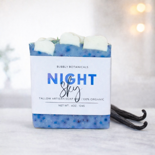 Handmade Night Sky vanilla tallow soap bar by Bubbly Botanicals with blue speckled design and cloud top on a clean white background