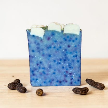 Handmade Night Sky vanilla tallow soap bar by Bubbly Botanicals with blue speckled design and cloud top on a clean white background Without a label