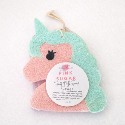 Pink and green goat milk soap sponge with a label on a white background