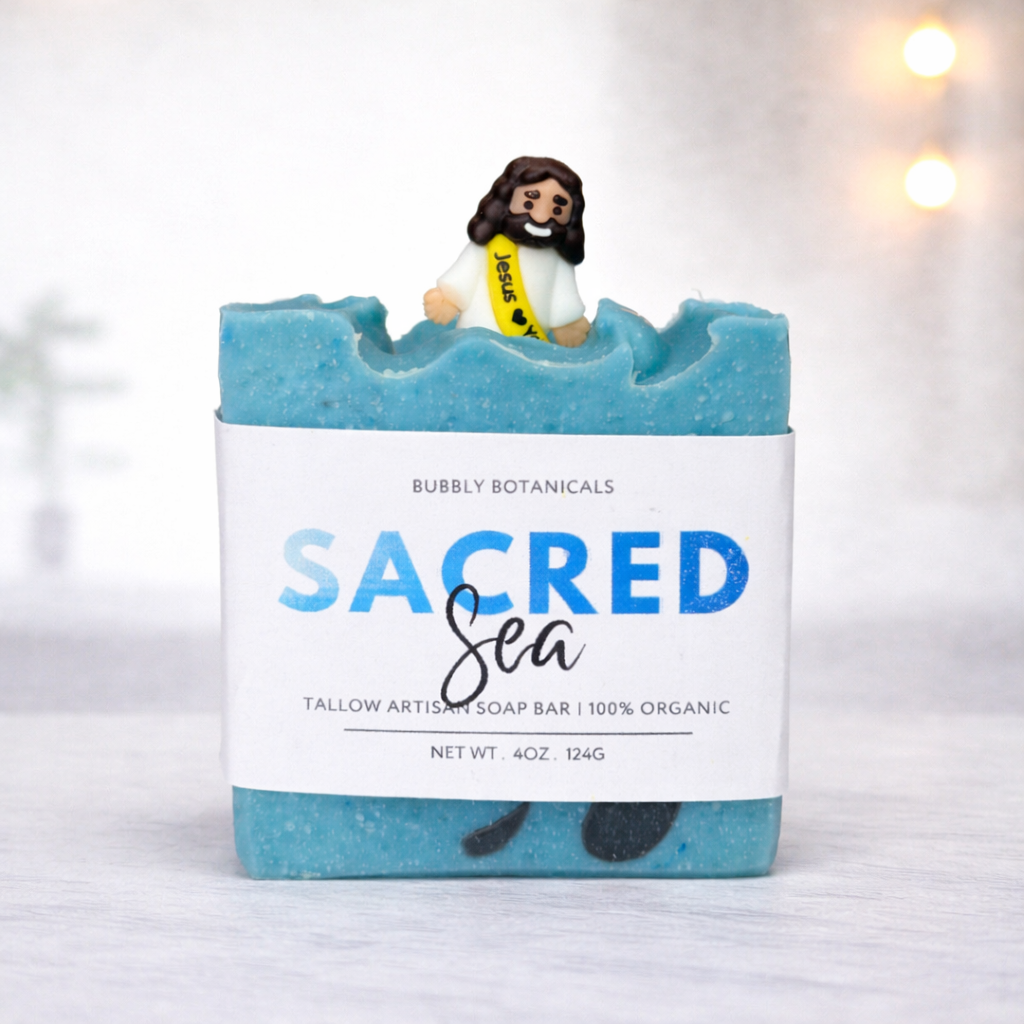 Sacred Sea tallow artisan soap by Bubbly Botanicals with ocean blue swirls and Jesus topper, Black Sea scent with musk and sandalwood