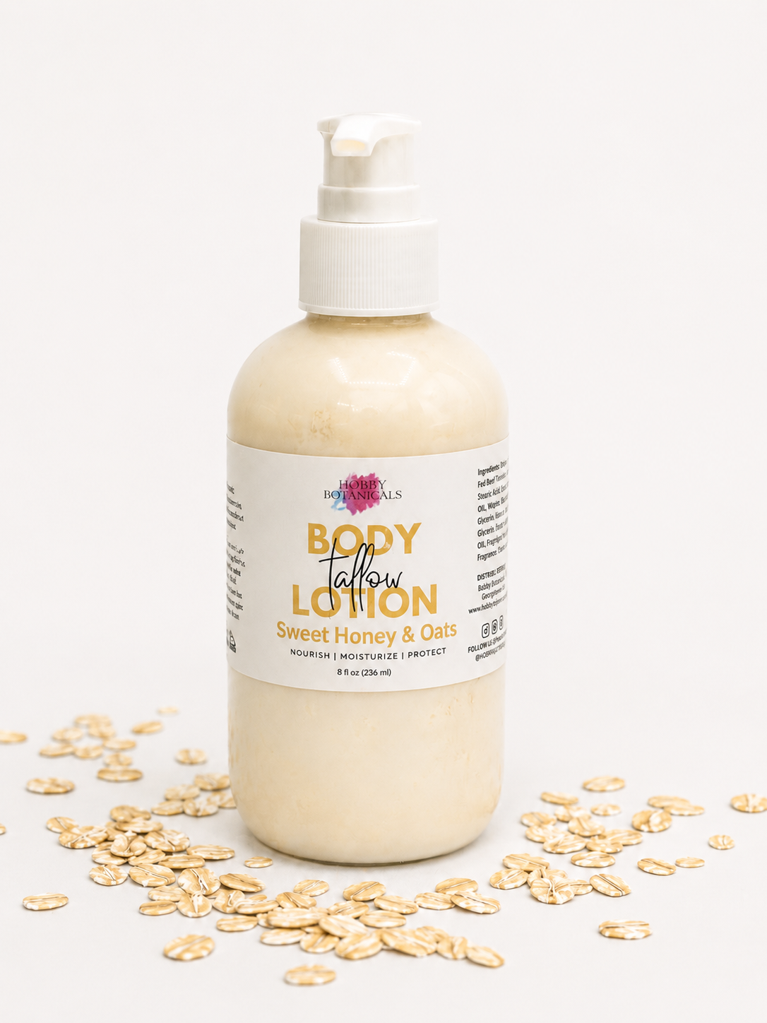 Grass-fed Tallow Body lotion bottle labeled 'Sweet Honey & Oats' with scattered oats on a white background