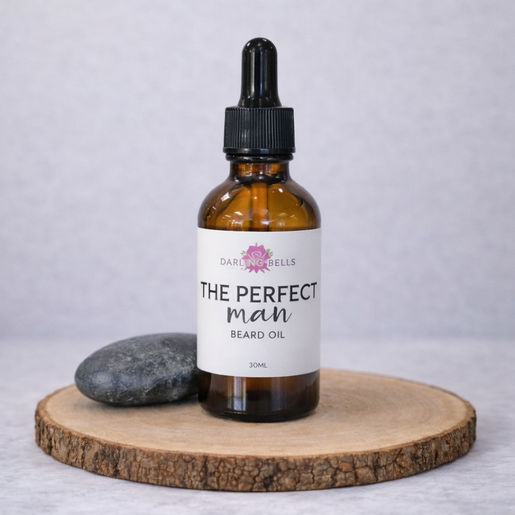 Bottle of 'The Perfect Man' beard oil on a wooden board with a gray background