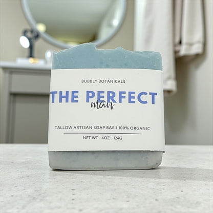 Bar of The perfect man tallow soap for men with a label on a bathroom counter