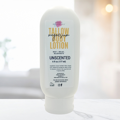 Bottle of tallow magnesia body lotion on a marble surface with a blurred background