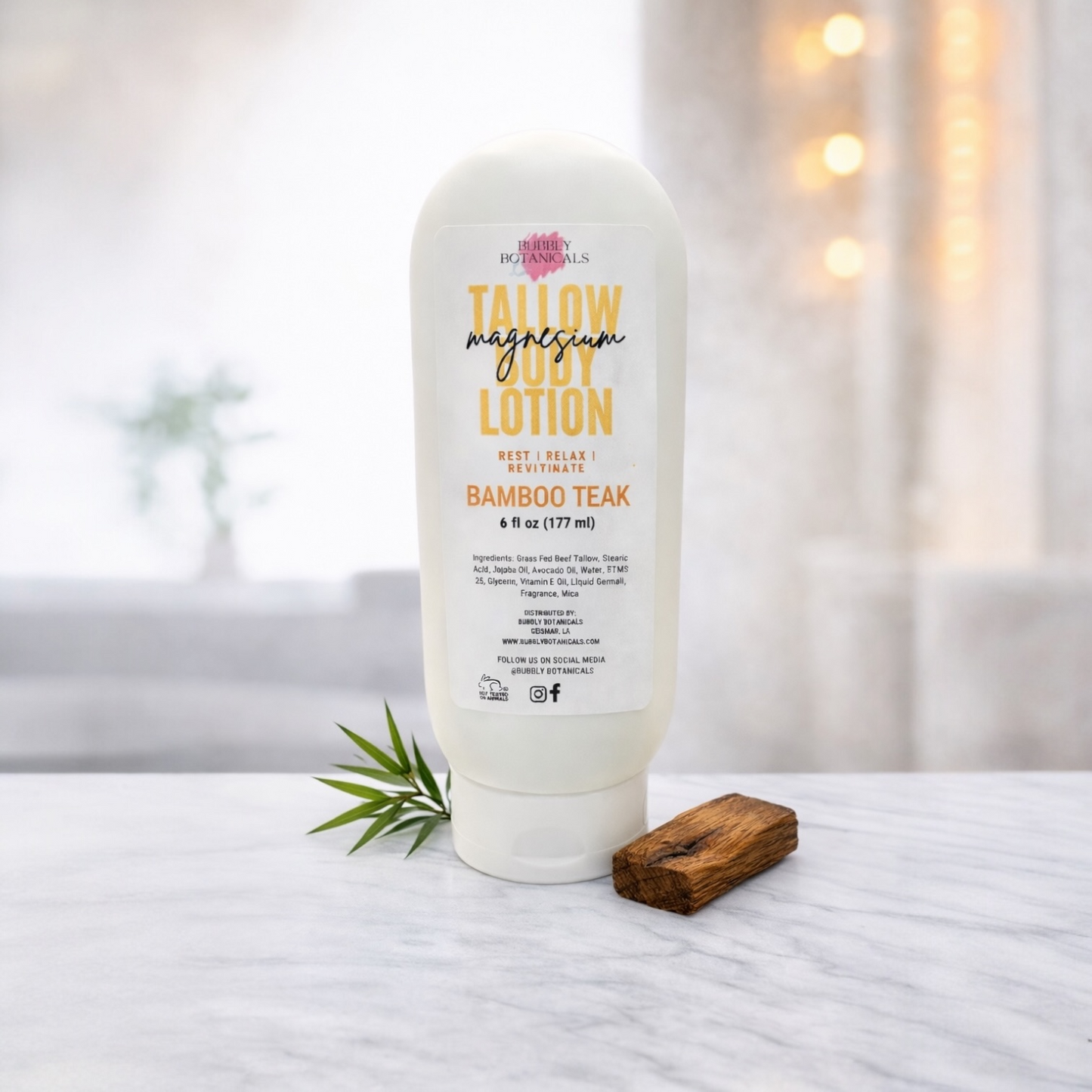 Bottle of magnesium lotion with bamboo tea scent on a white surface