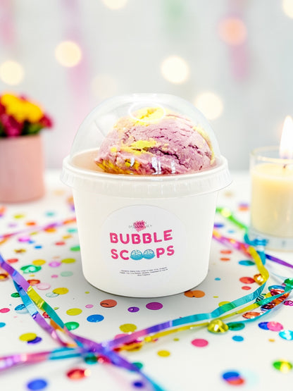 Ice cream in a 'Bubble Scoops' container with colorful straws and confetti on a light background