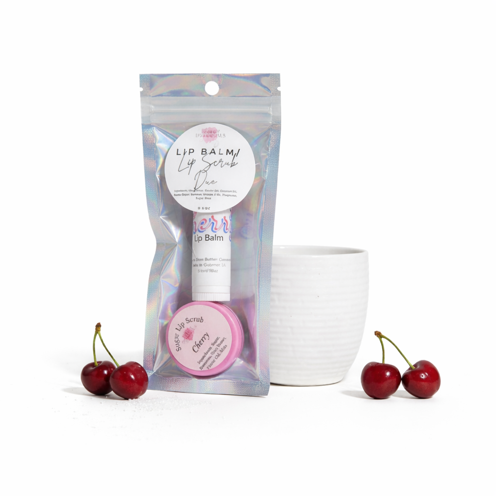 Lip balm with packaging and cherries on a white background