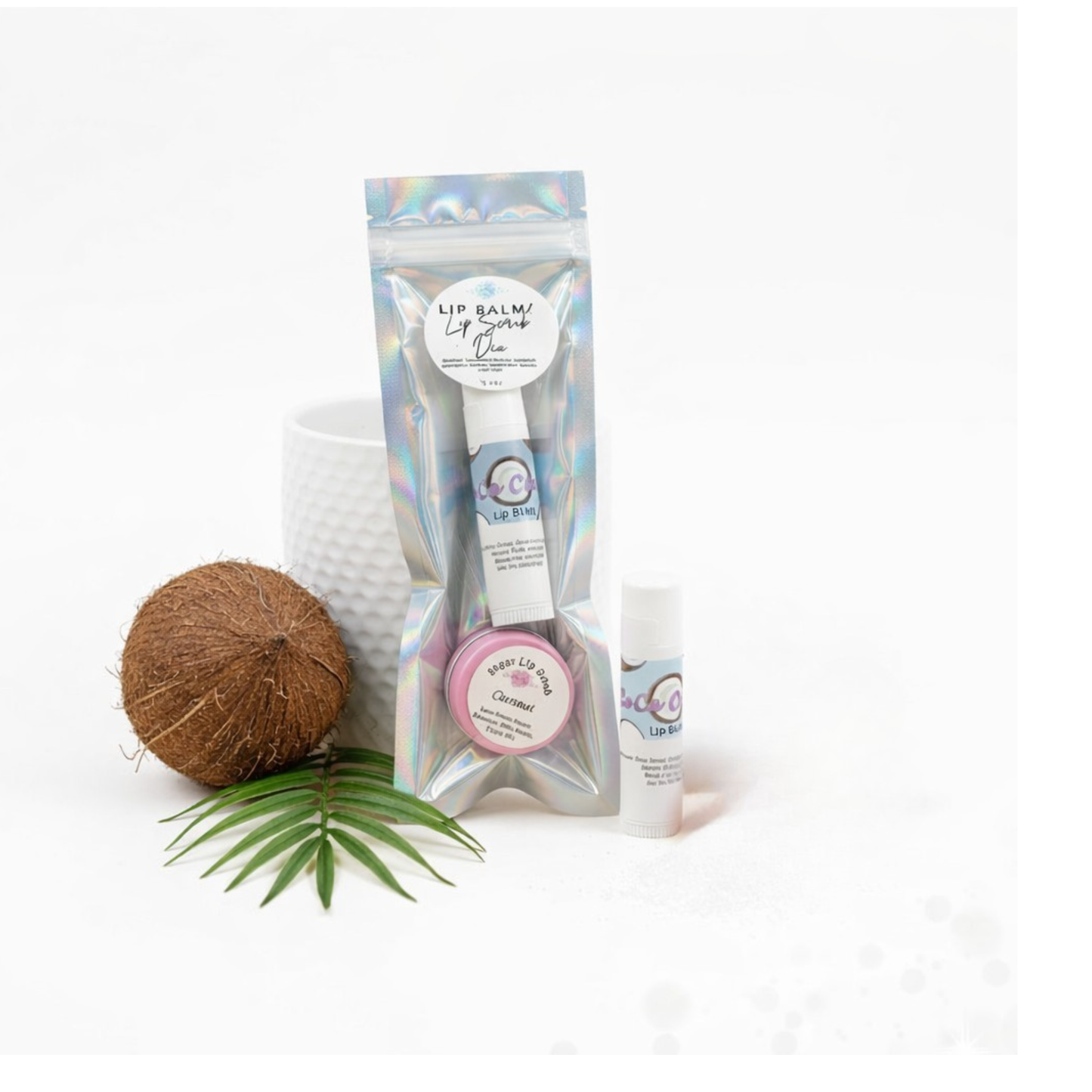 Lip balm packaging with coconut and leaf on a white background
