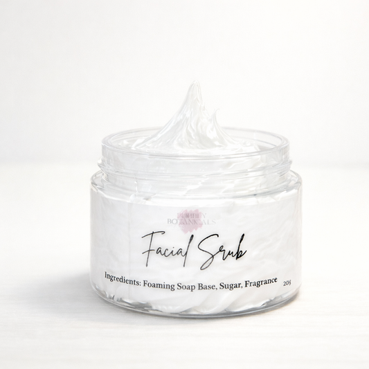 Clear jar of facial scrub with a white background