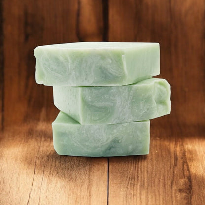 Stack of Green Tea & Lemongrass Tallow Soap bars on a wooden surface
