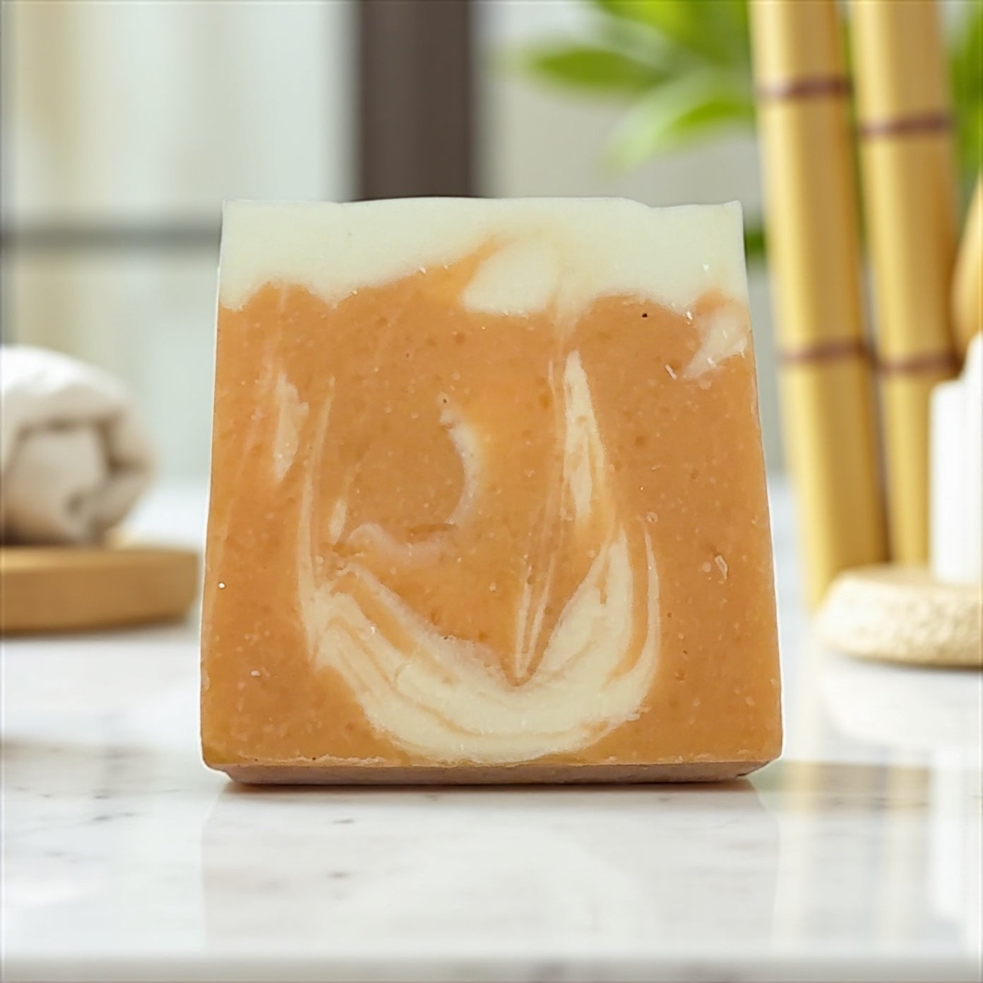 Bar of soap with a marbled design on a marble surface