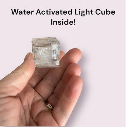 Party Bomb bath bomb by Bubbly Botanicals with a water activated light cube inside