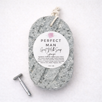 Gray goat milk soap infused sponge scented with 'Perfect Man' fragrance on a white background