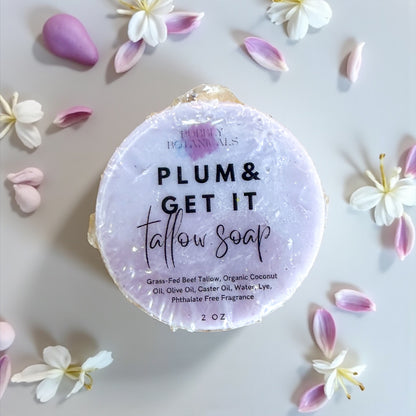 Tallow soap with 'Plum & Get It' text surrounded by flowers on a light background