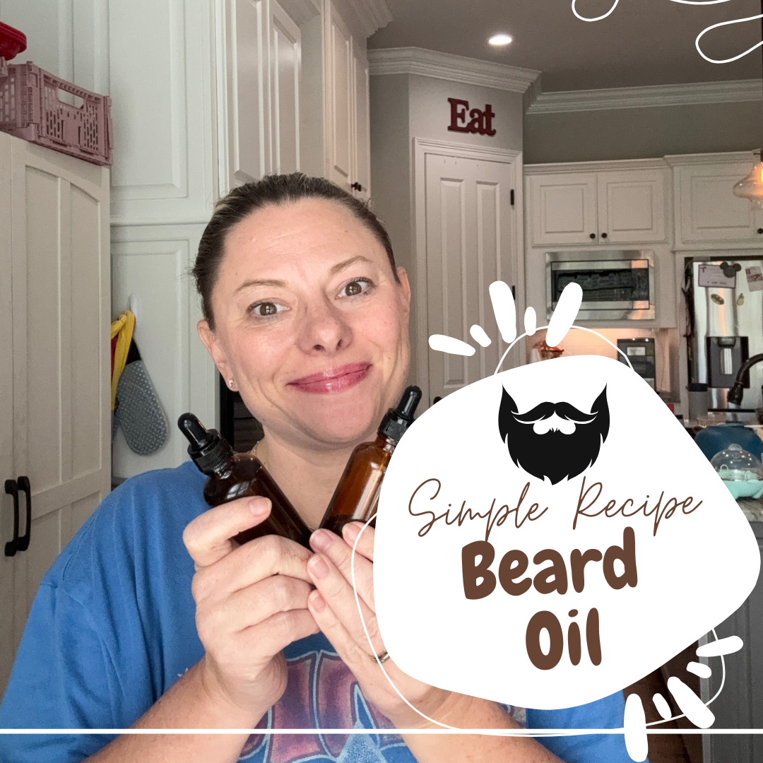Person holding a bottle of beard oil with a kitchen background